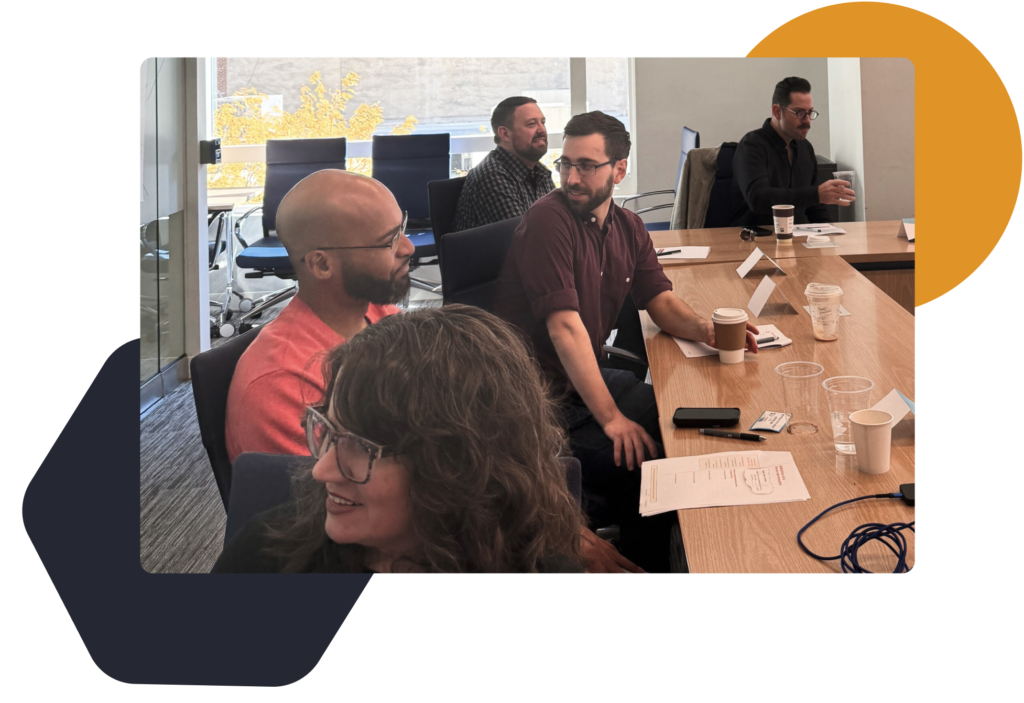 Some of the Mile6 team in discussions during an exercise during a team building workshop.